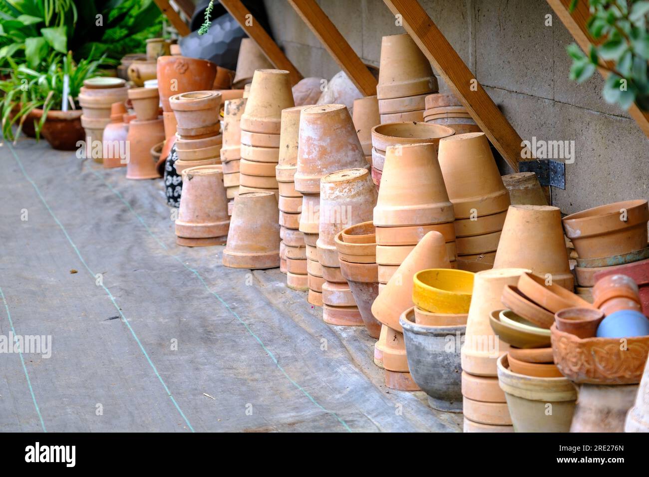 Garden Tools and clay pots in the garden . Gardening Concept Stock