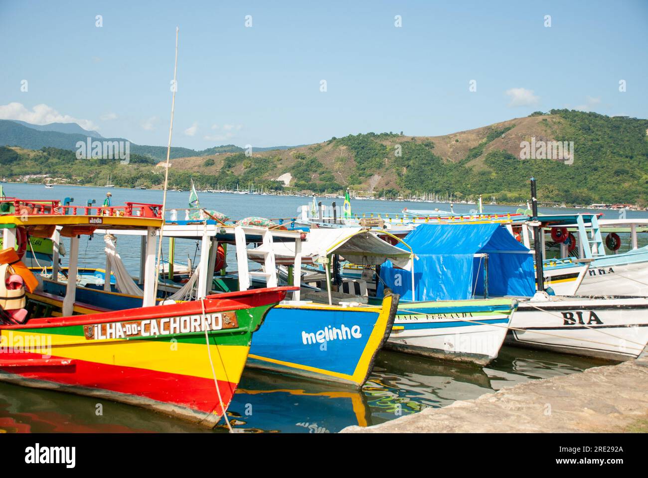 Vibrant wooden boats docked in Paraty, Rio de Janeiro, Brazil, showcasing coastal charm Stock Photo