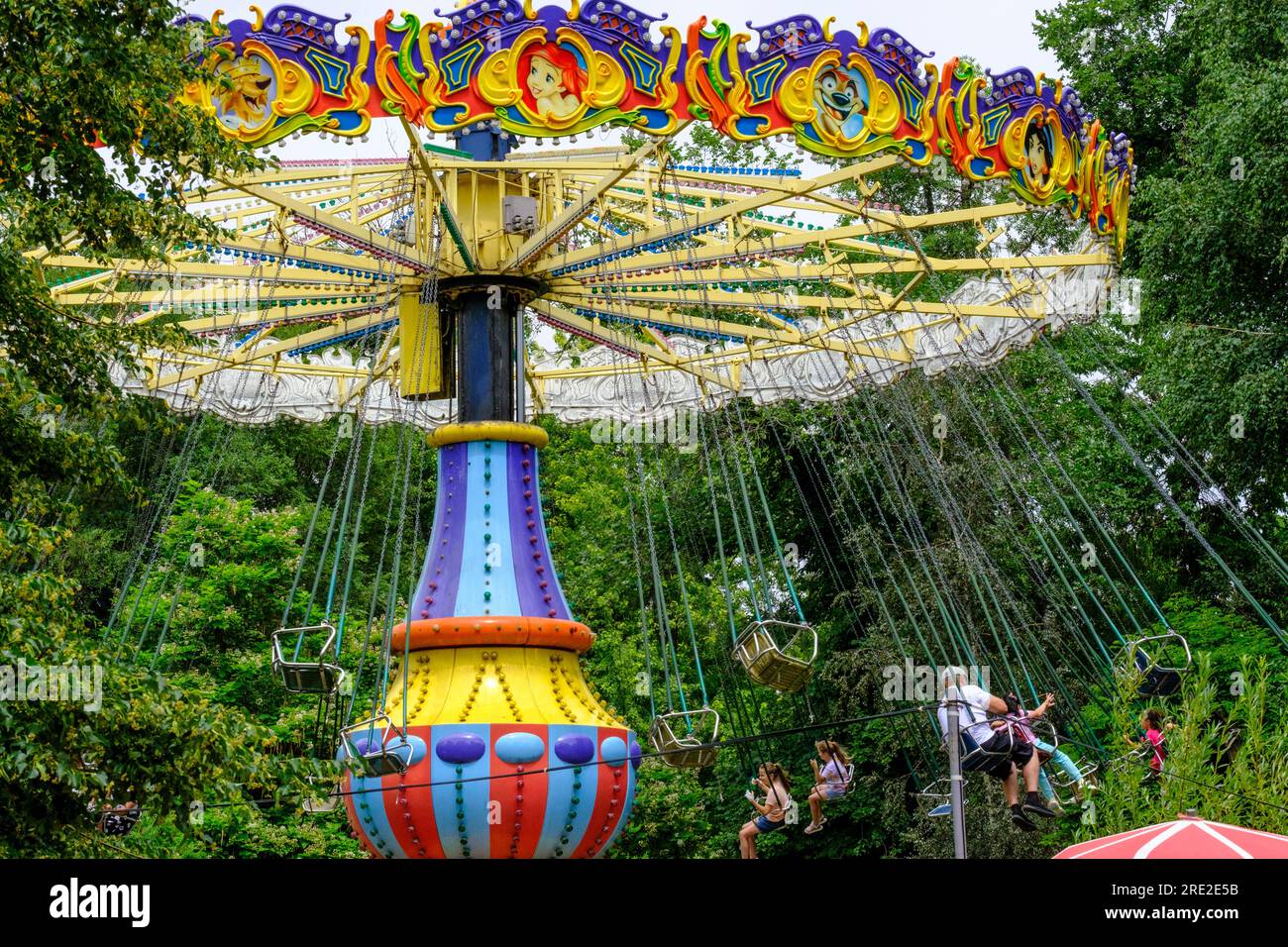 Kazakhstan, Almaty. People on Amusement Park Ride, Central Park for Culture and Recreation. Stock Photo