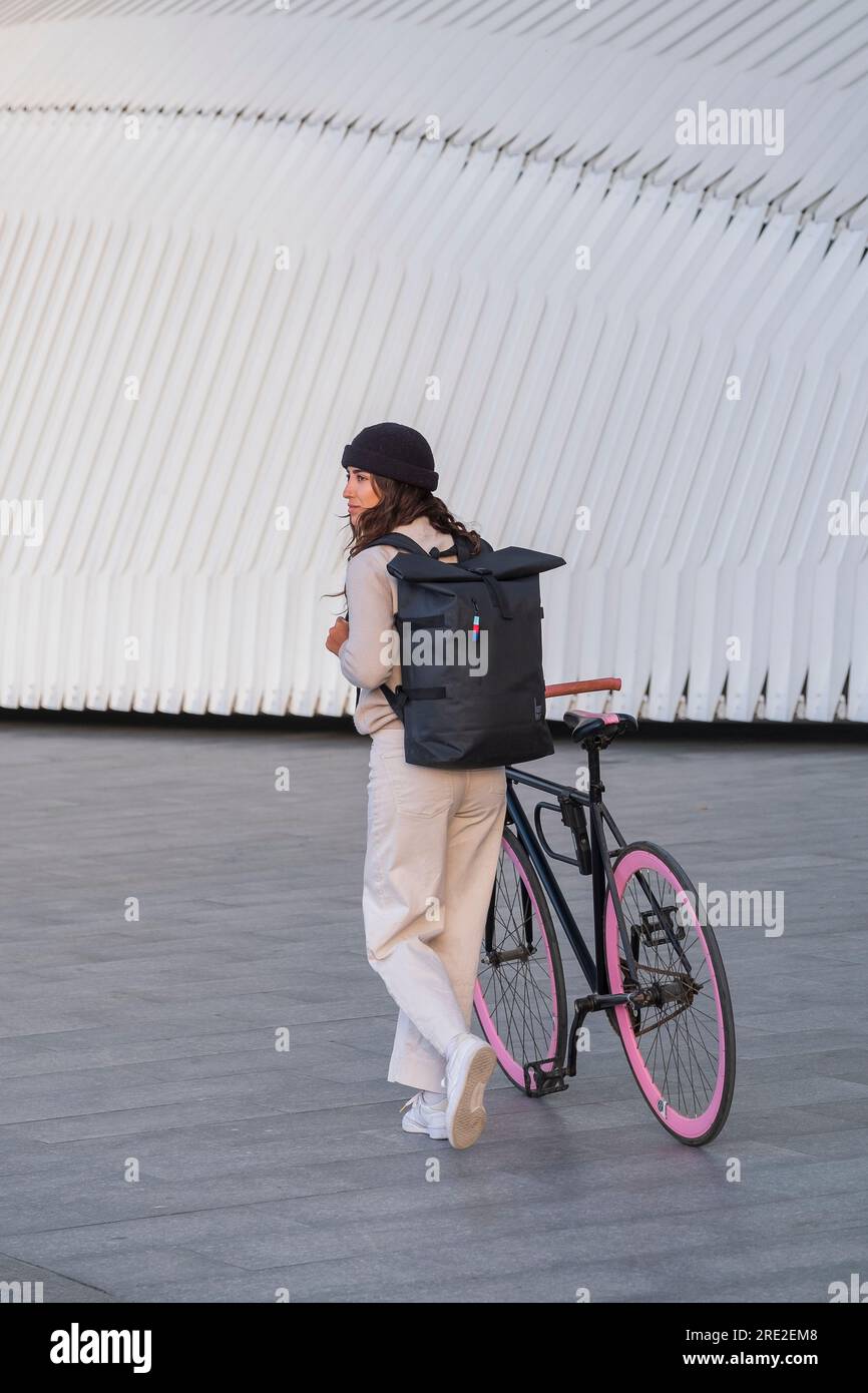 Young woman with a very fancy bicycle in the City of Arts and Sciences in Valencia. Stock Photo