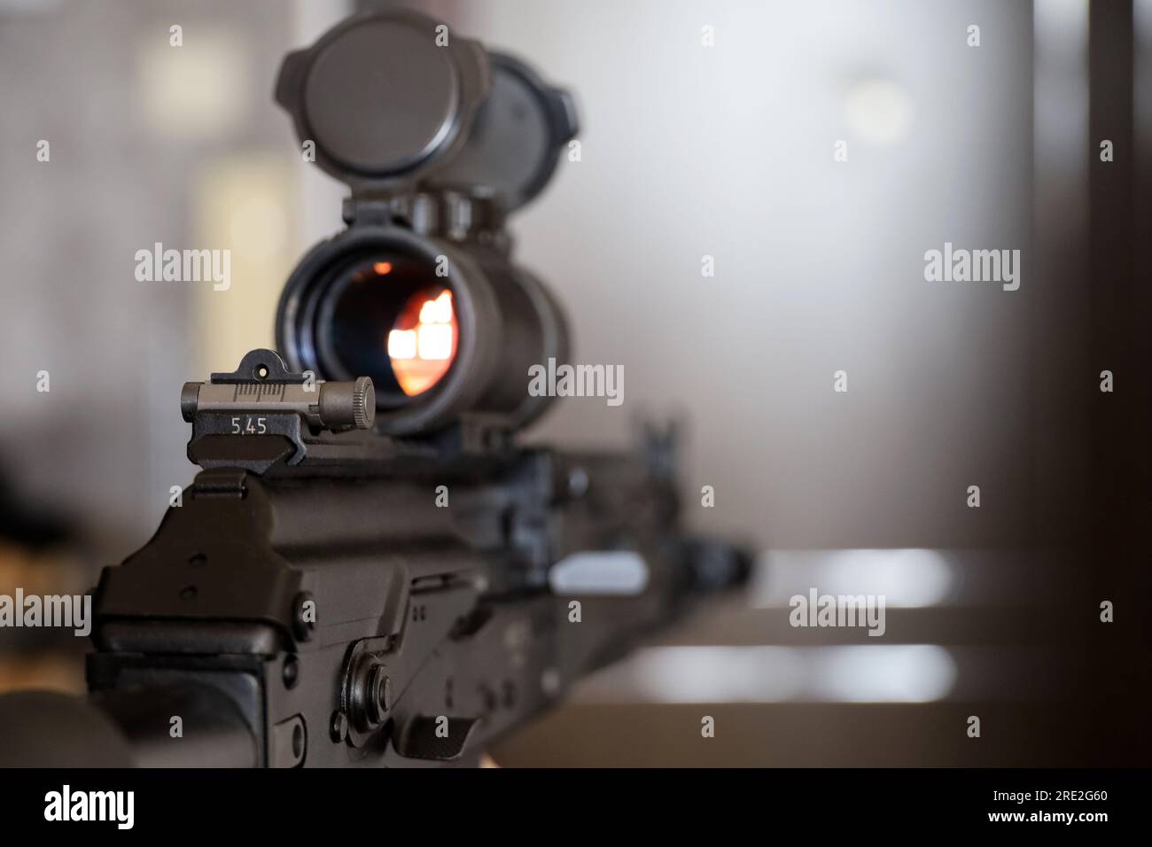 Assault rifle with collimator sight close up, selective focus. Modern weapon of military force Stock Photo