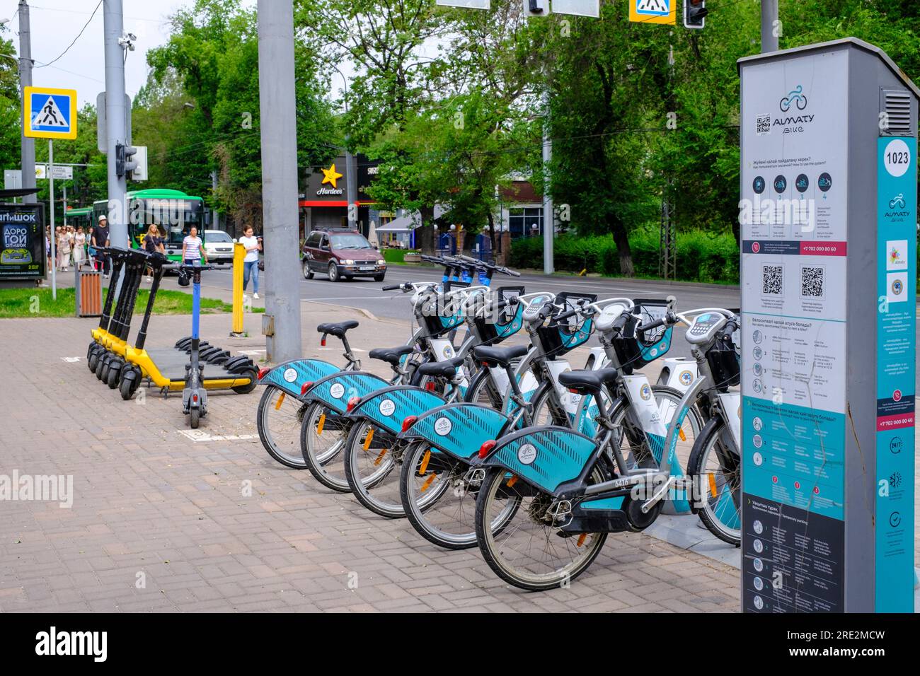 Kazakhstan, Almaty. Street Scene with Rental Bicycles and Scooters