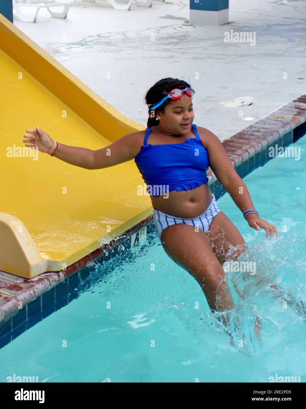 Tenyearold Khloe Woodson makes quite a splash as she glides off the