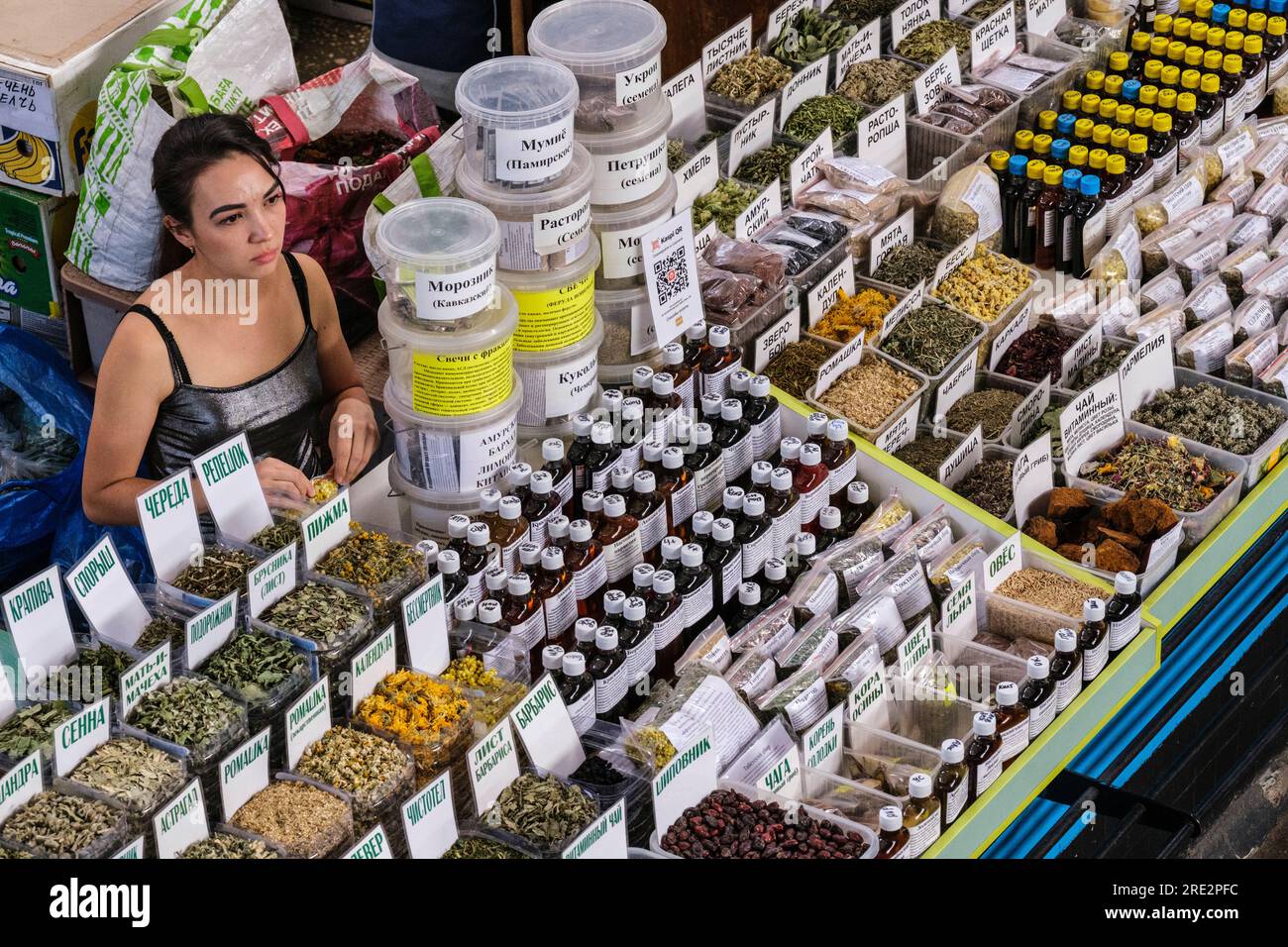 Kazakhstan, Almaty. Green Bazaar Vendor of Health Care Supplements and Herbal Teas. Stock Photo