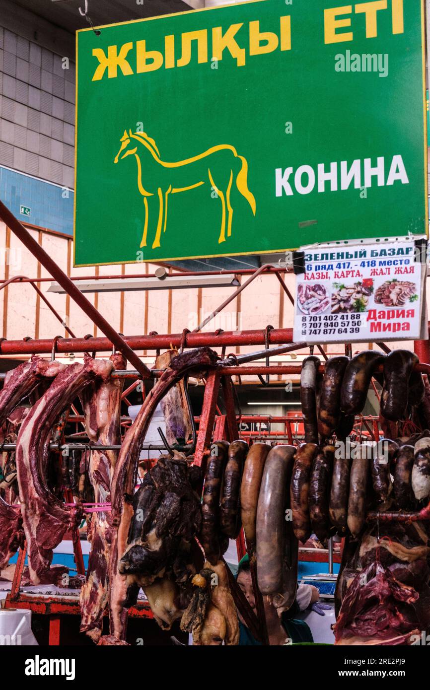 Kazakhstan, Almaty. Horse Meat Counter in the Green Bazaar. Stock Photo