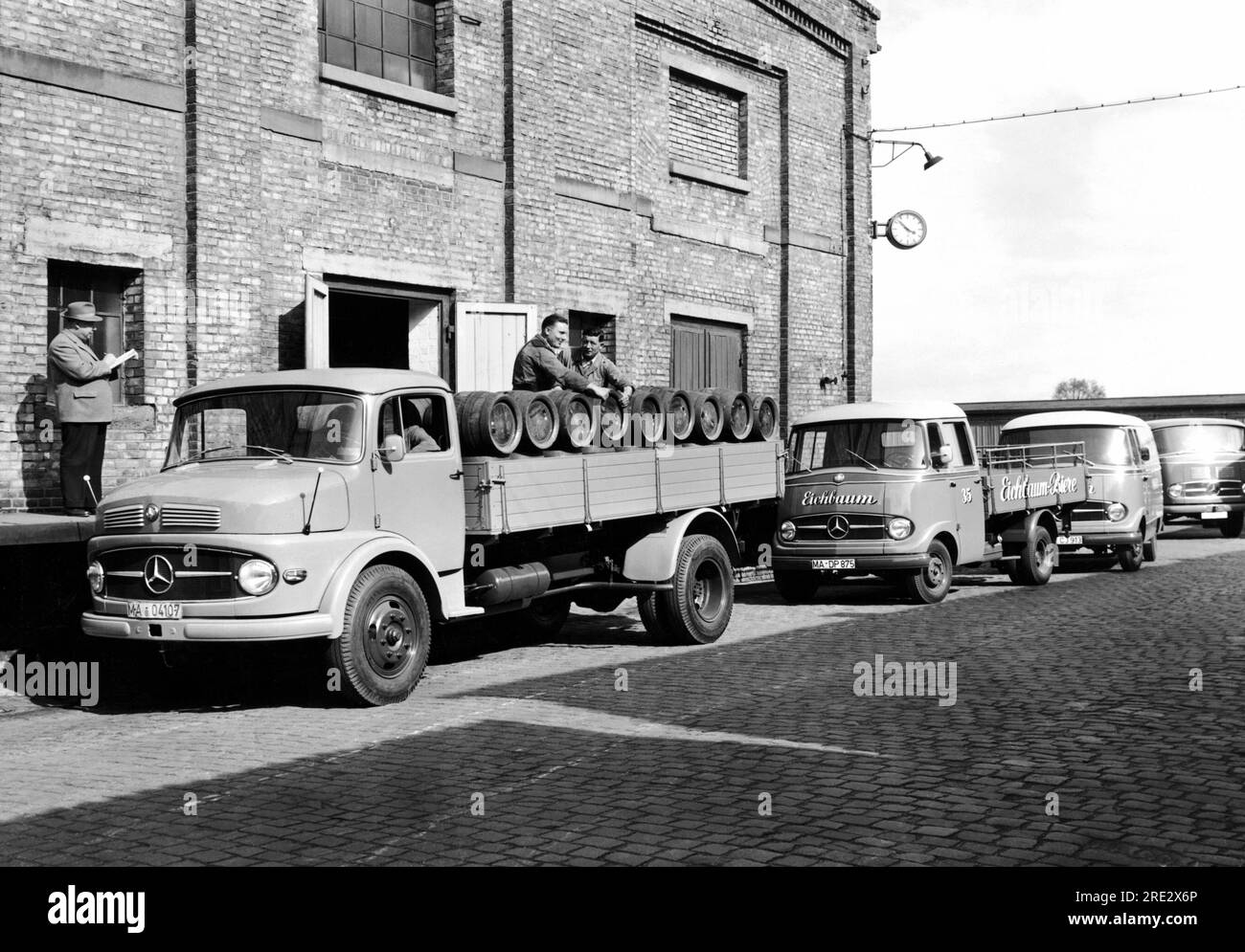 Germany 1958 A MercedesBenz L322 delivery truck picking up kegs of