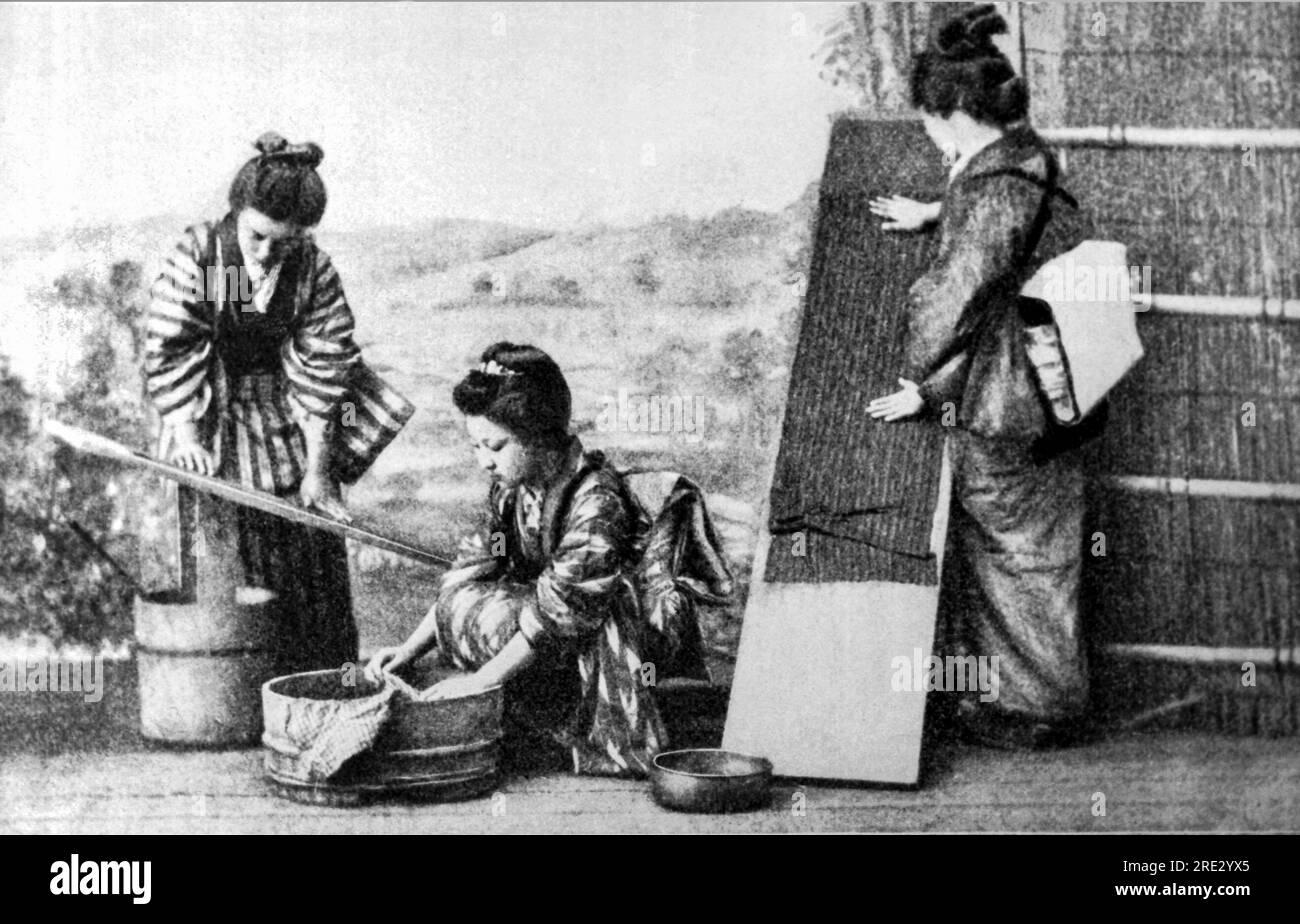Japan:  c. 1890 Japanese women doing laundry and ironiing. Stock Photo