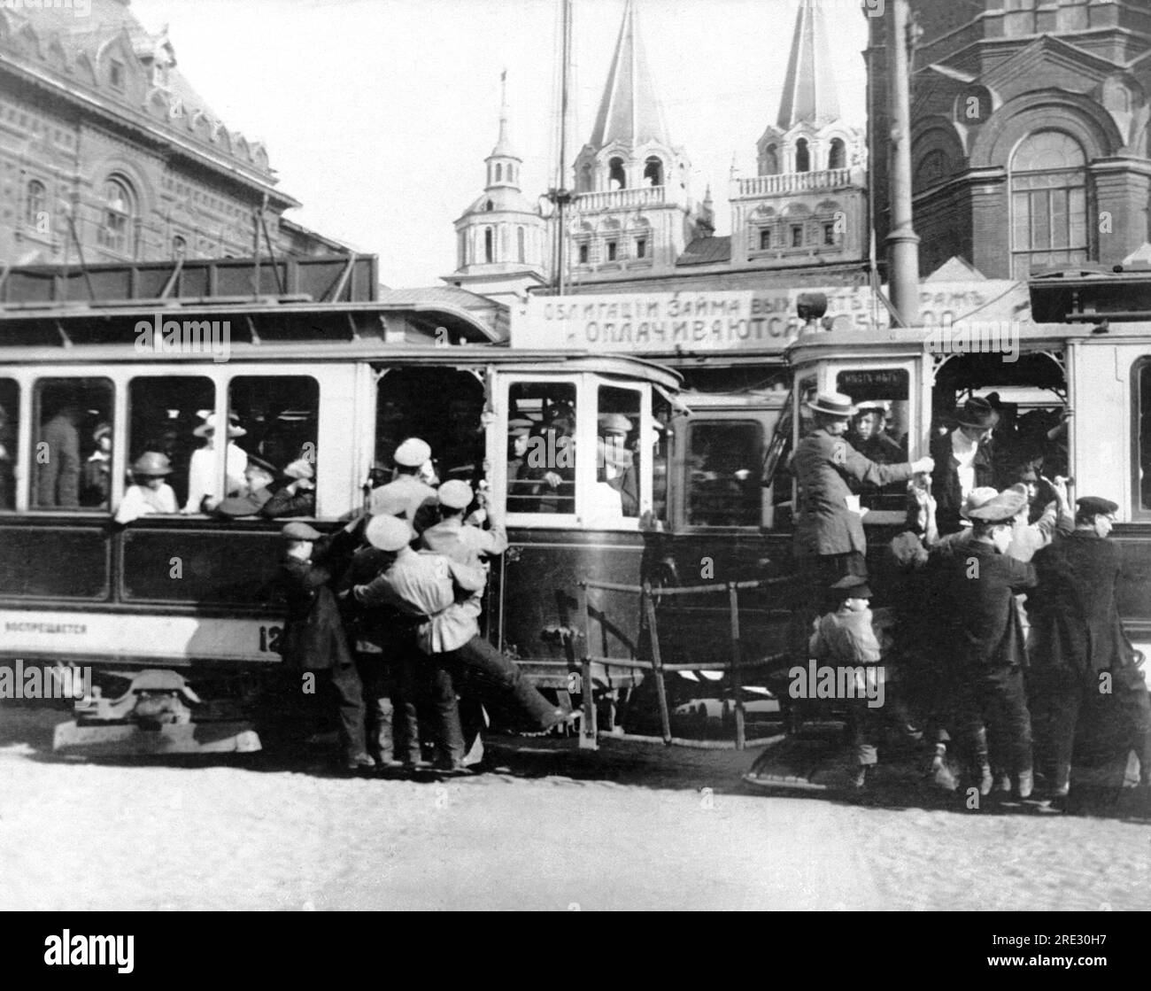 Moscow, Russia:  September 9, 1918 A crowded street car in Moscow. The populoation of Moscow has exploded since the government seat was moved there from Petrograd.. Stock Photo