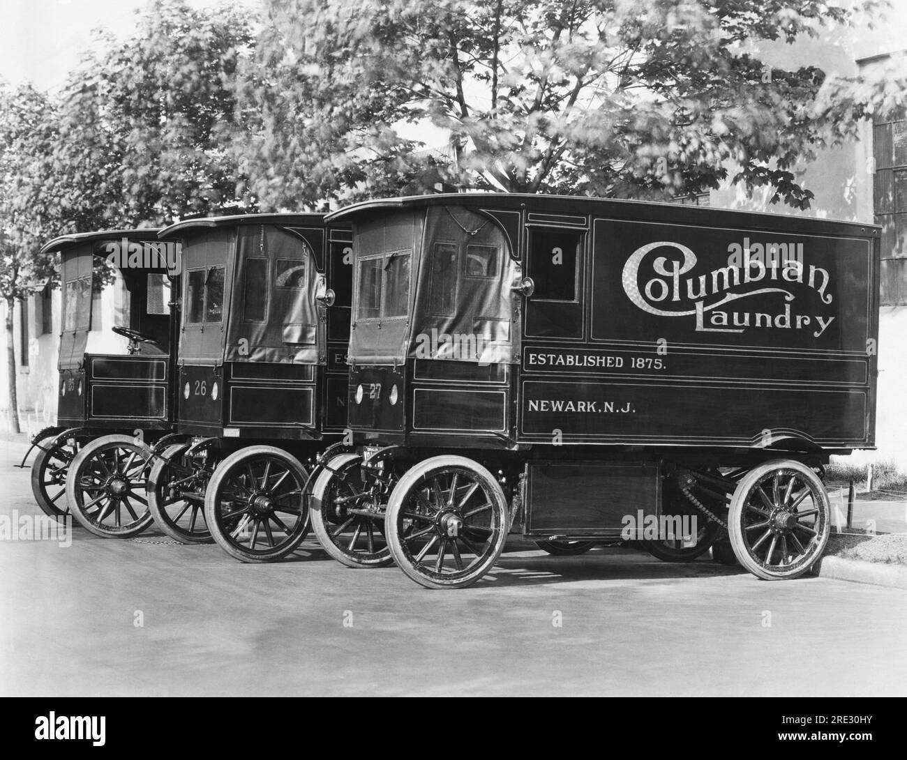 Newark, New Jersey: c. 1910 Three Columbian Laundry trucks parked in a