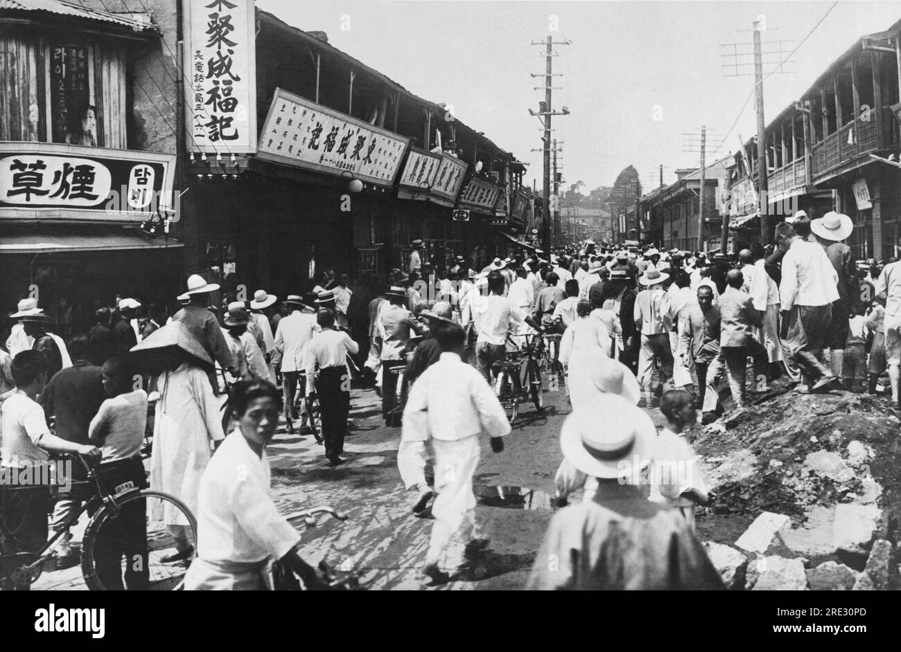 Seoul, Korea:  July 5, 1931 A street scene in Seoul as a mob of Koreans attack Chinese homes and shops in retaliation for the Chinese attempt to drive Korean farmers from Wanpaoshan, Manchuria. A few days after the Wanpaoshan affair, Koreans in Seoul and other Korean towns began attacking Chinese residents. Stock Photo