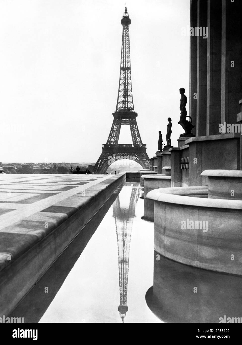 Paris, France:  c. 1938 The Eiffel Tower is reflected in the pool in front of the Trocadero in Paris. Stock Photo