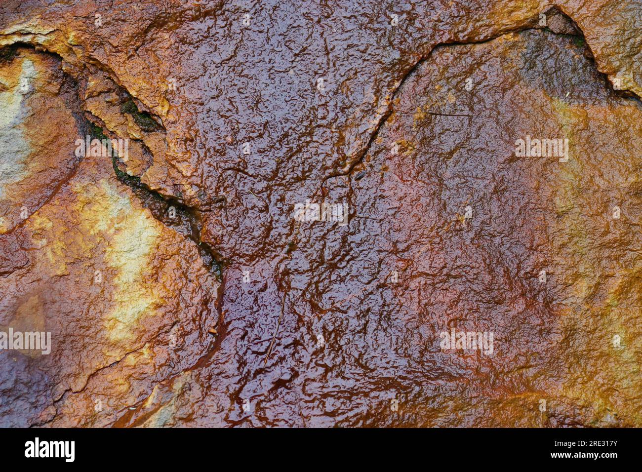 Rust colored rock wall Stock Photo Alamy