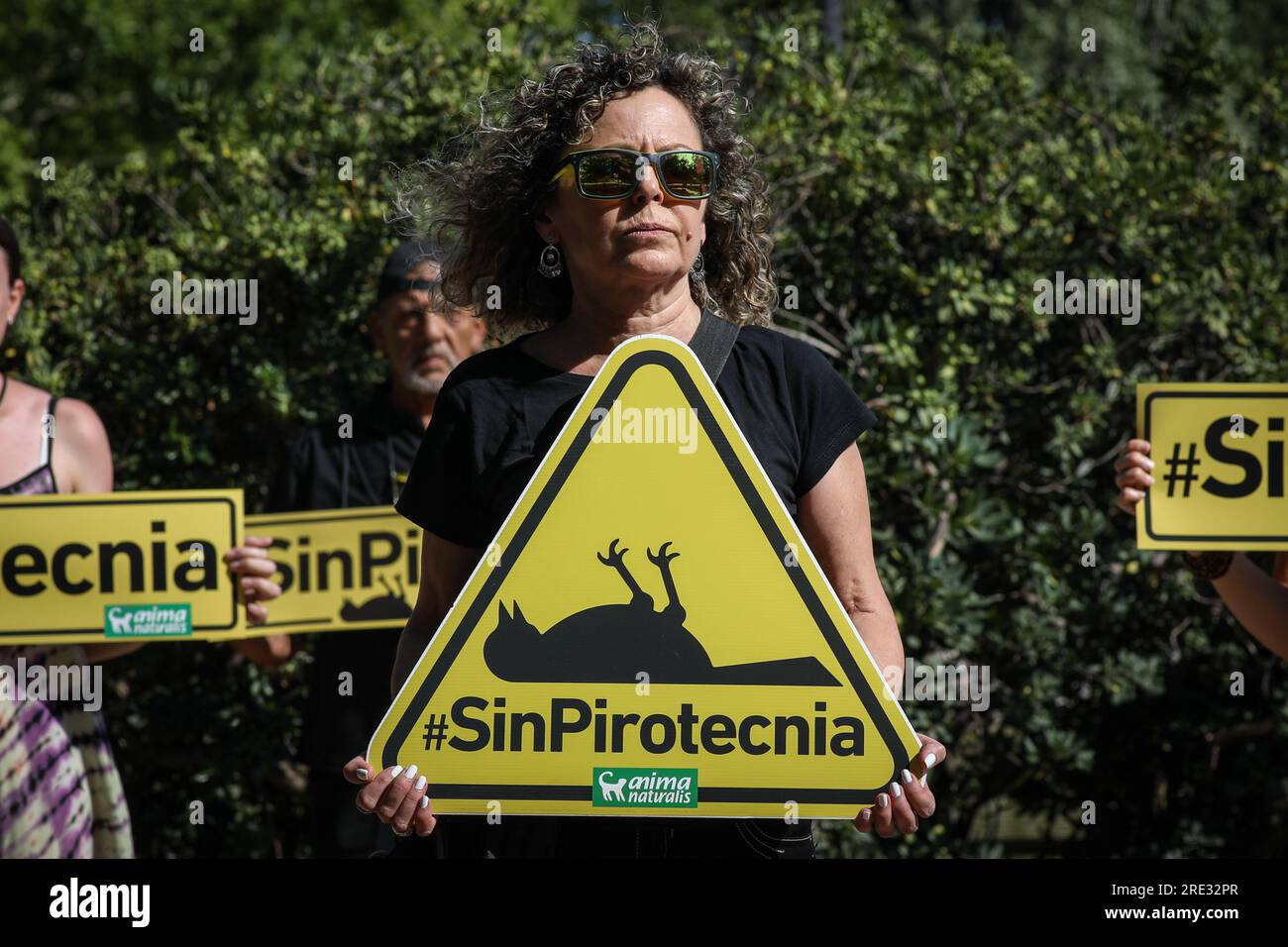 Madrid, Spain. 24th July, 2023. An activist holds a placard with the phrase No Fireworks to demand respect for animal welfare during the demonstration. The organization for the Defense of Animals AnimaNaturalis demands that the Collado Villalba City Council stops using noisy fireworks and start using fireworks that do not thunder. (Photo by David Canales/SOPA Images/Sipa USA) Credit: Sipa USA/Alamy Live News Stock Photo