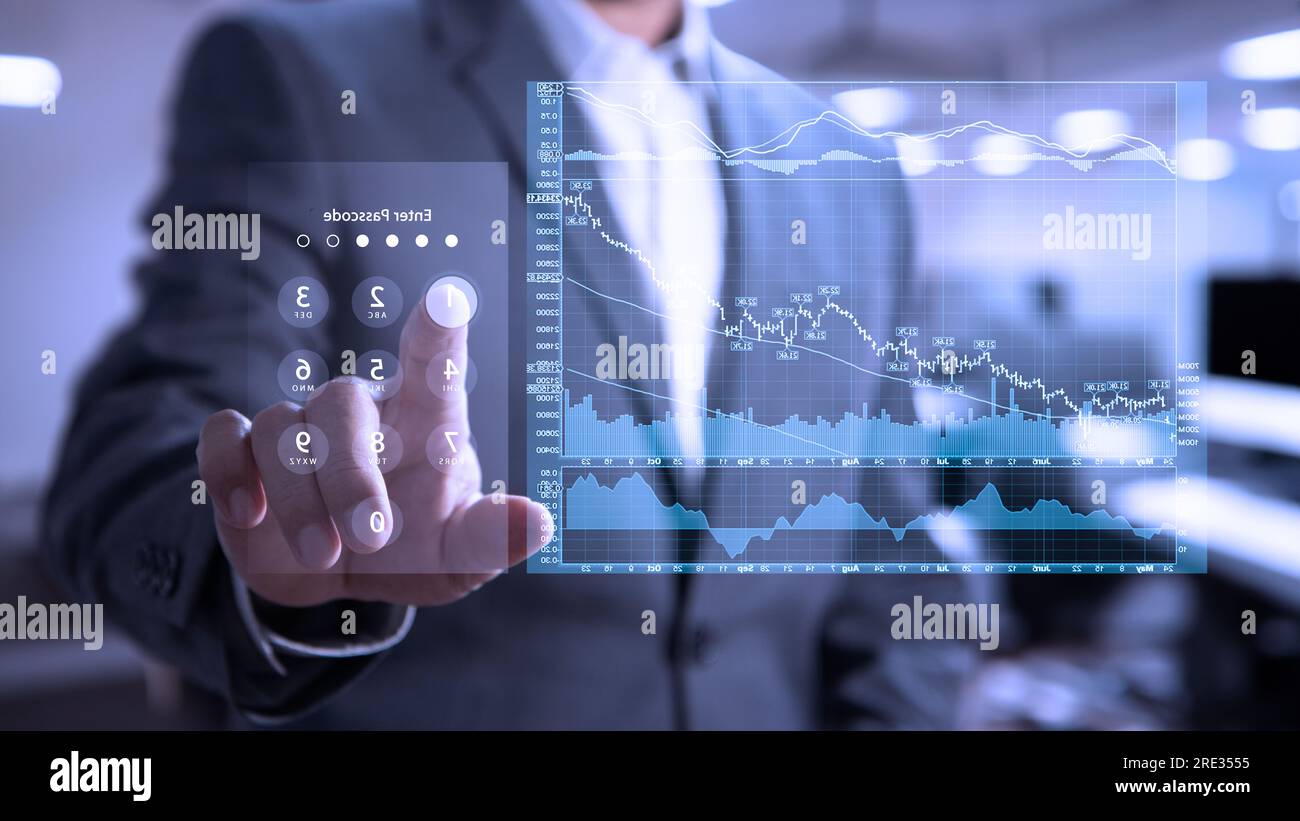 Businessman in the office interacting to augmented reality or virtual touch screen to enter passcode for business data analysis Stock Photo