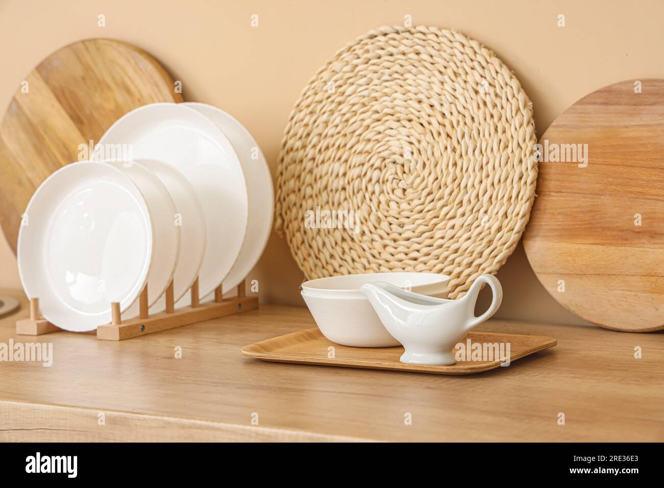 Kitchen counter with plate rack, clean dishes and cutting boards Stock Photo