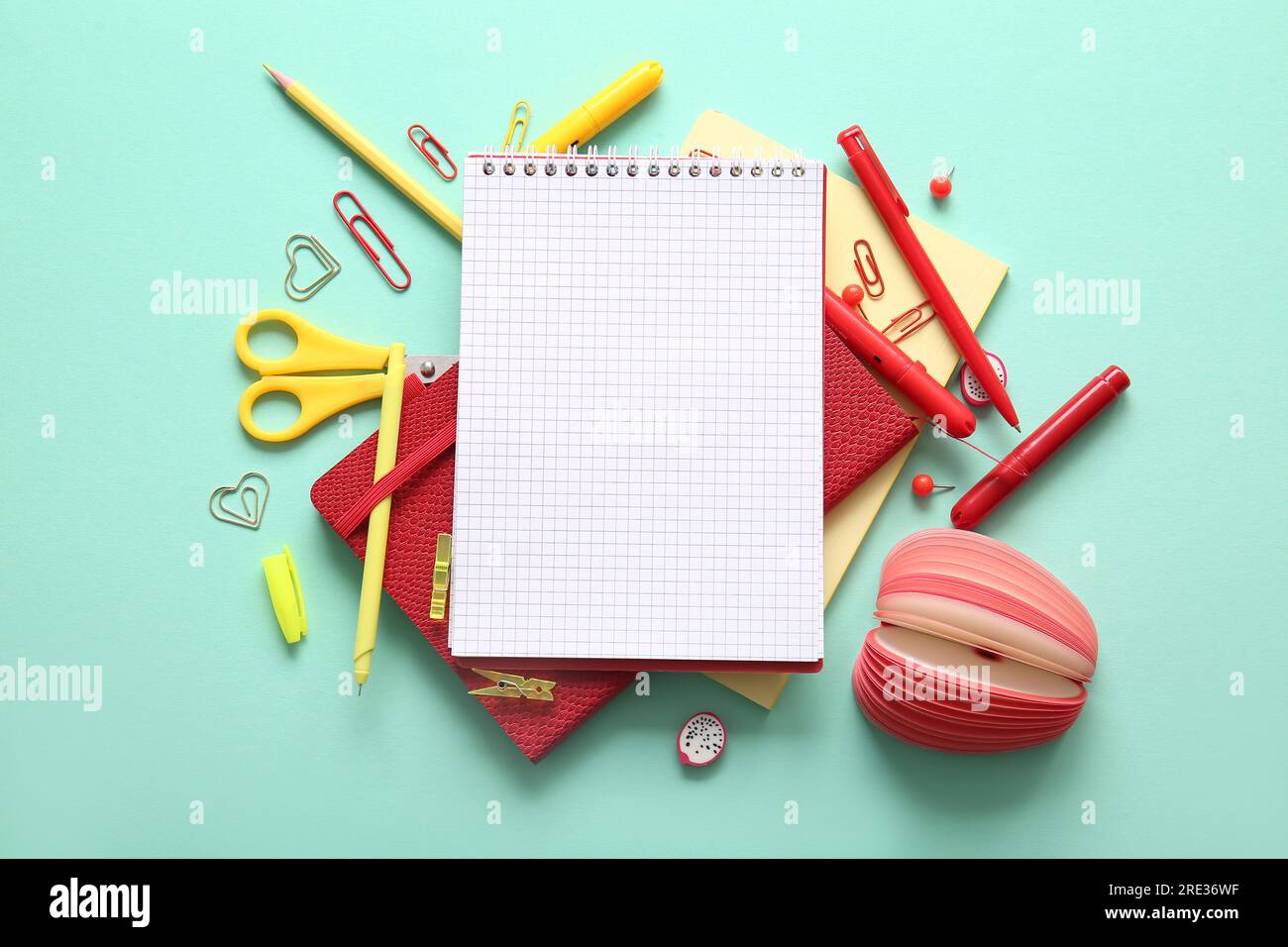 Composition with blank notebook and different school stationery on ...