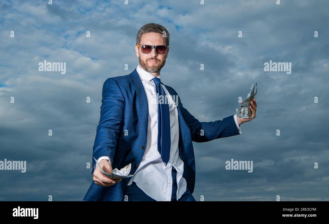 rich billionaire man with money in suit. photo of billionaire man with