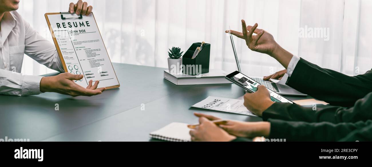 Candidate and interviewers discuss work experience and qualifications