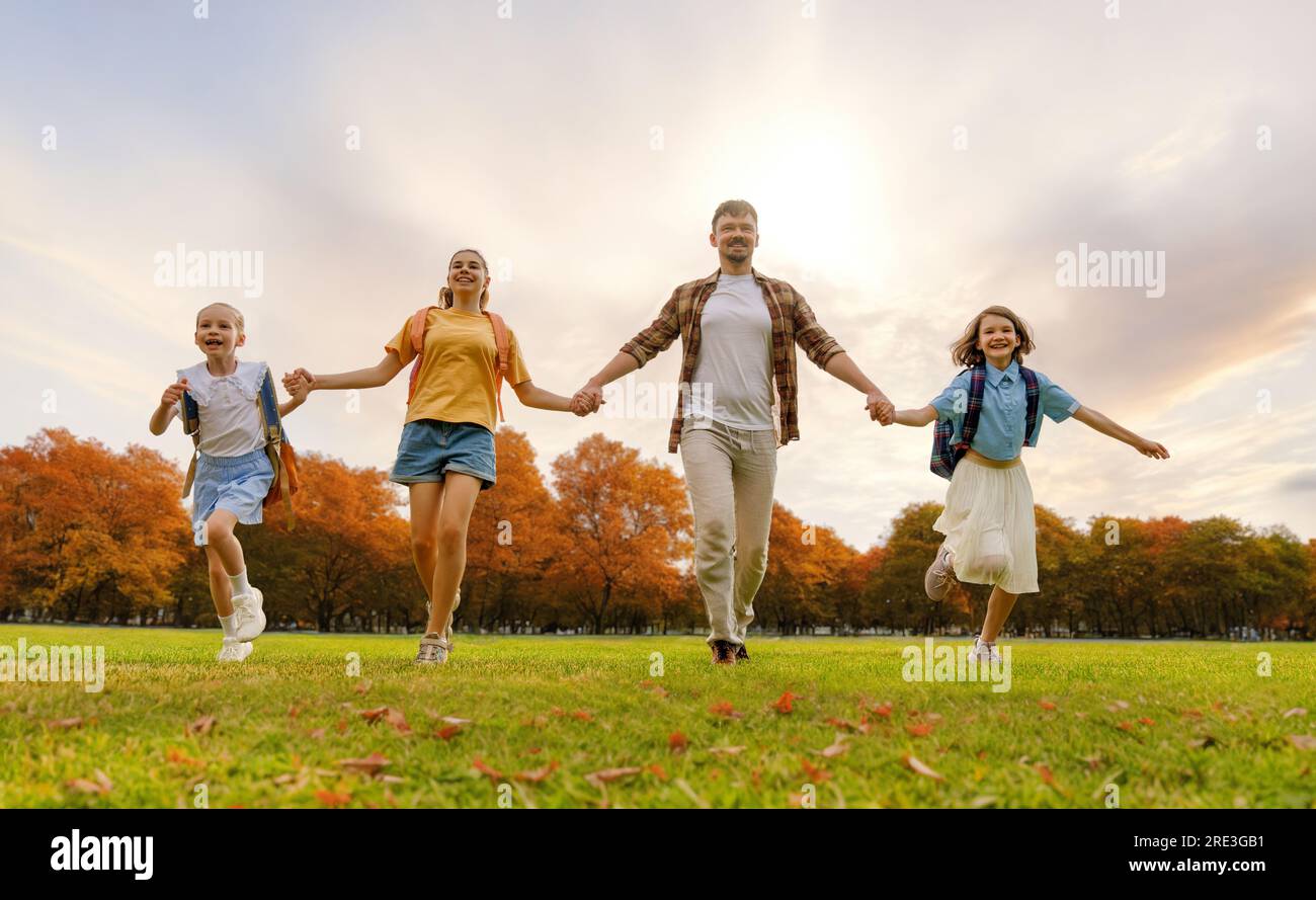 Pupils of the school. Girls with backpacks outdoors. Teens and their ...