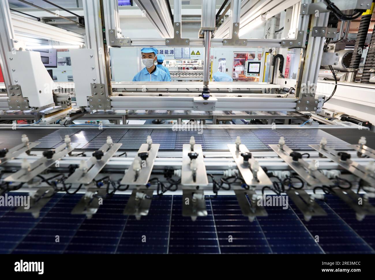 Workers are busy producing the solar photovoltaic modules for export at ...