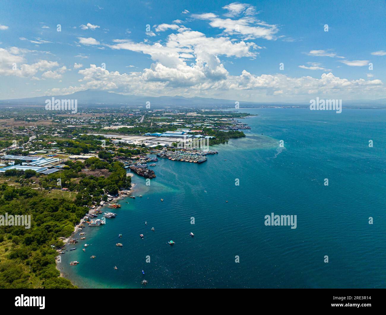 Blue sea and sky with clouds, view from the drone. General Santos Fishport. Mindanao, Philippines. Stock Photo