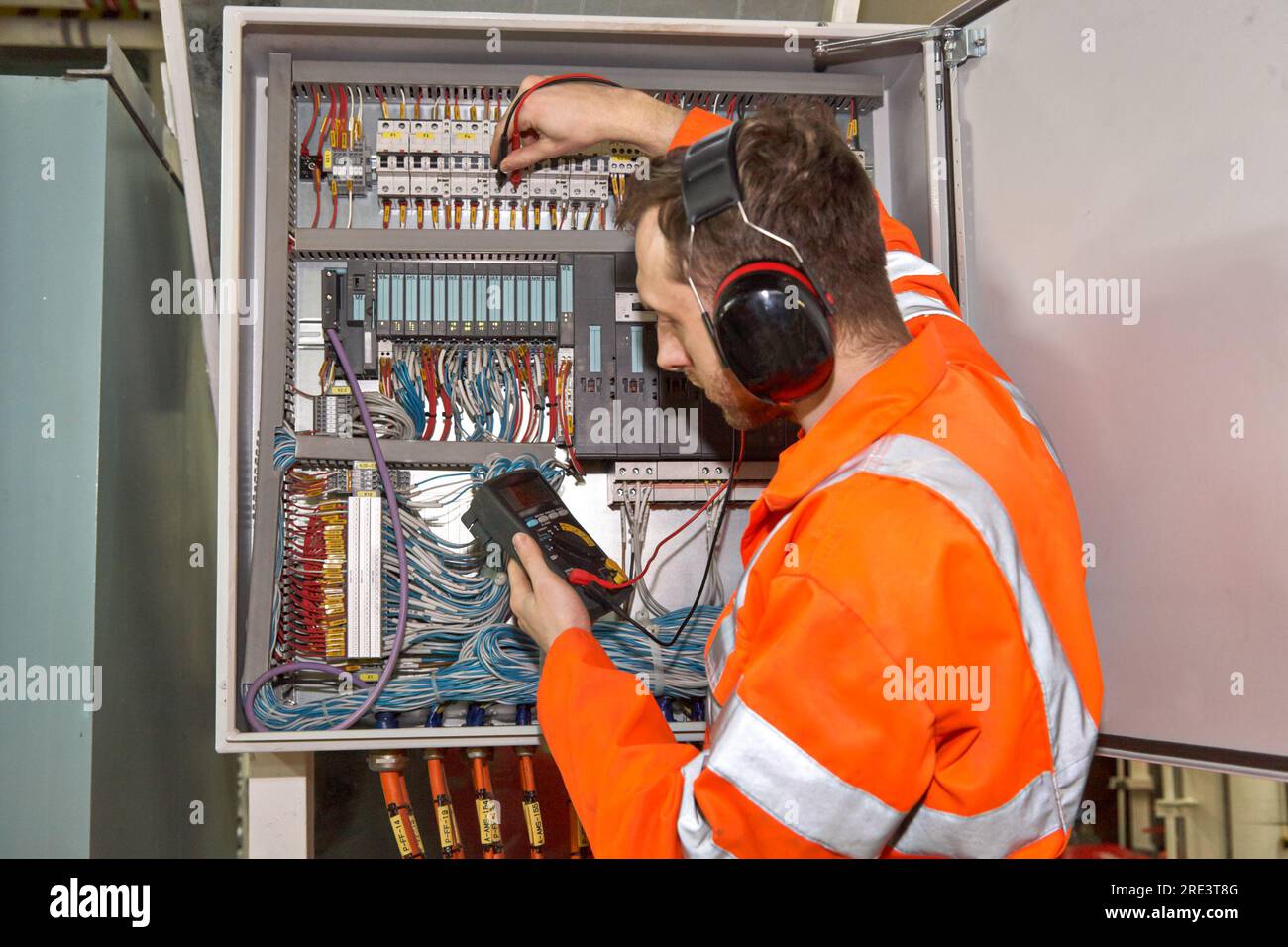 Electrician checking fuses Stock Photo