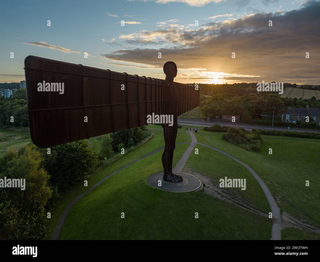 Side on drone shot of Angel of the North with sun rising on the wind tip Stock Photo