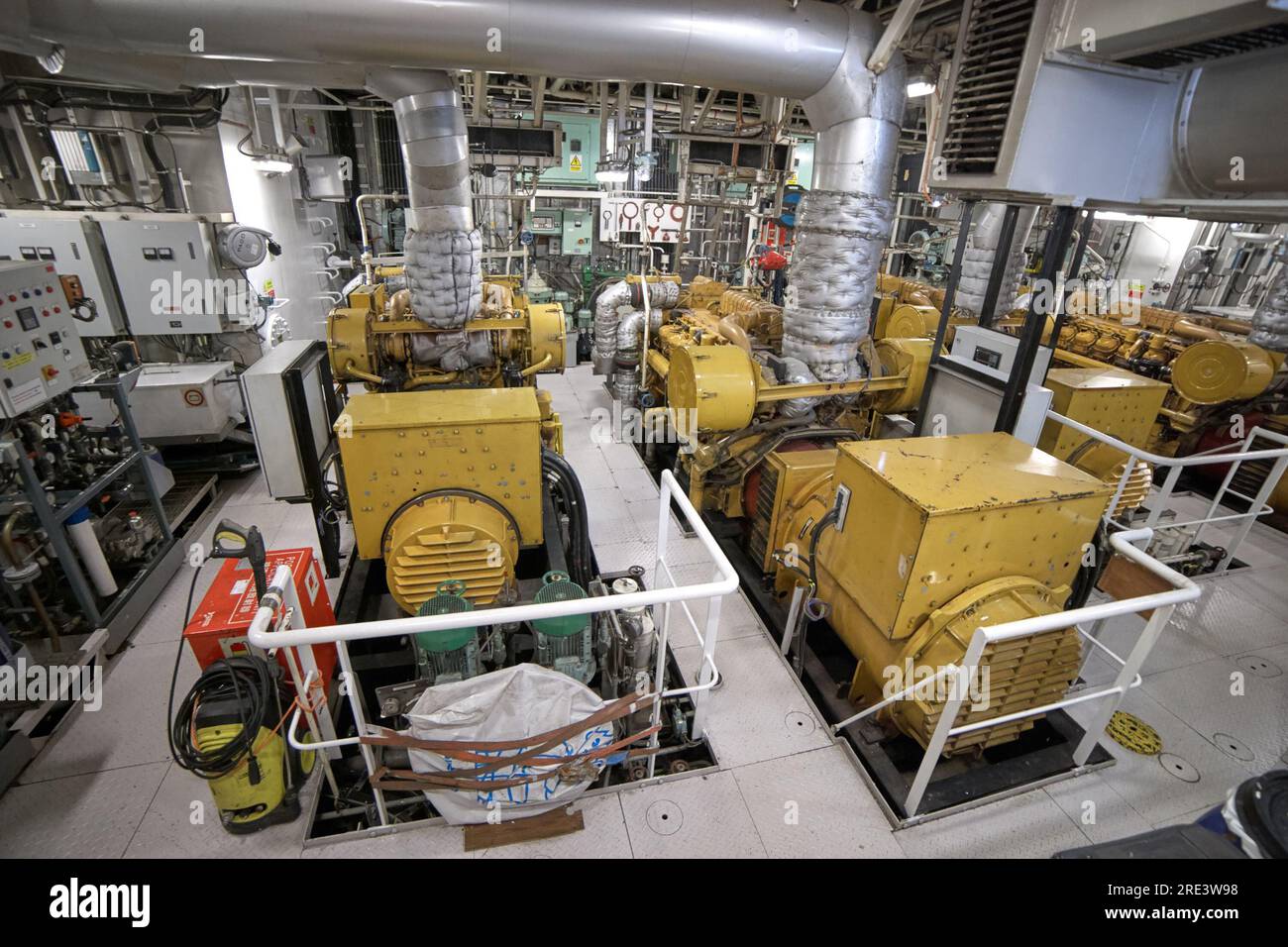 Engine room view with diesel engines and generators. Stock Photo