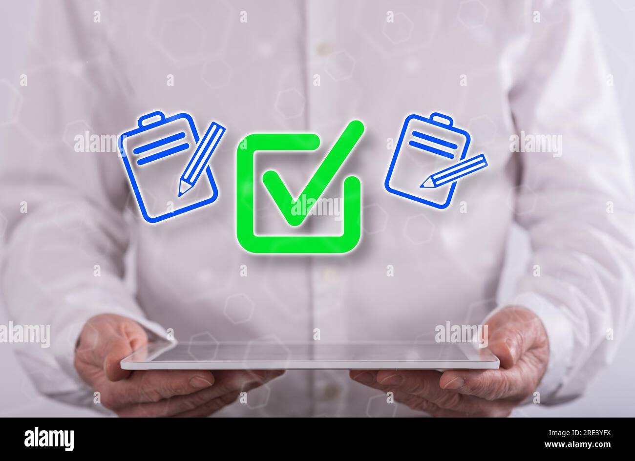 Document validation concept above a tablet held by a man in background Stock Photo