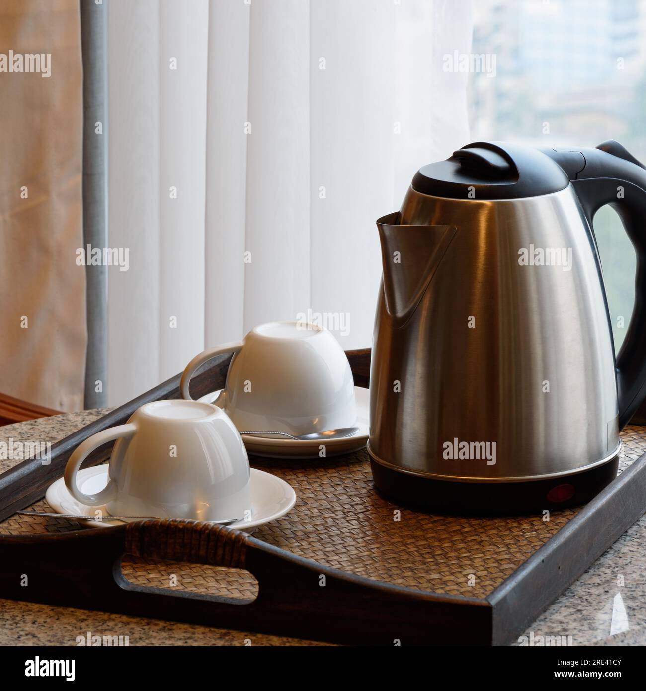 Electric kettle and coffee cup set in hotel room, ceramic cup set Stock Photo Alamy