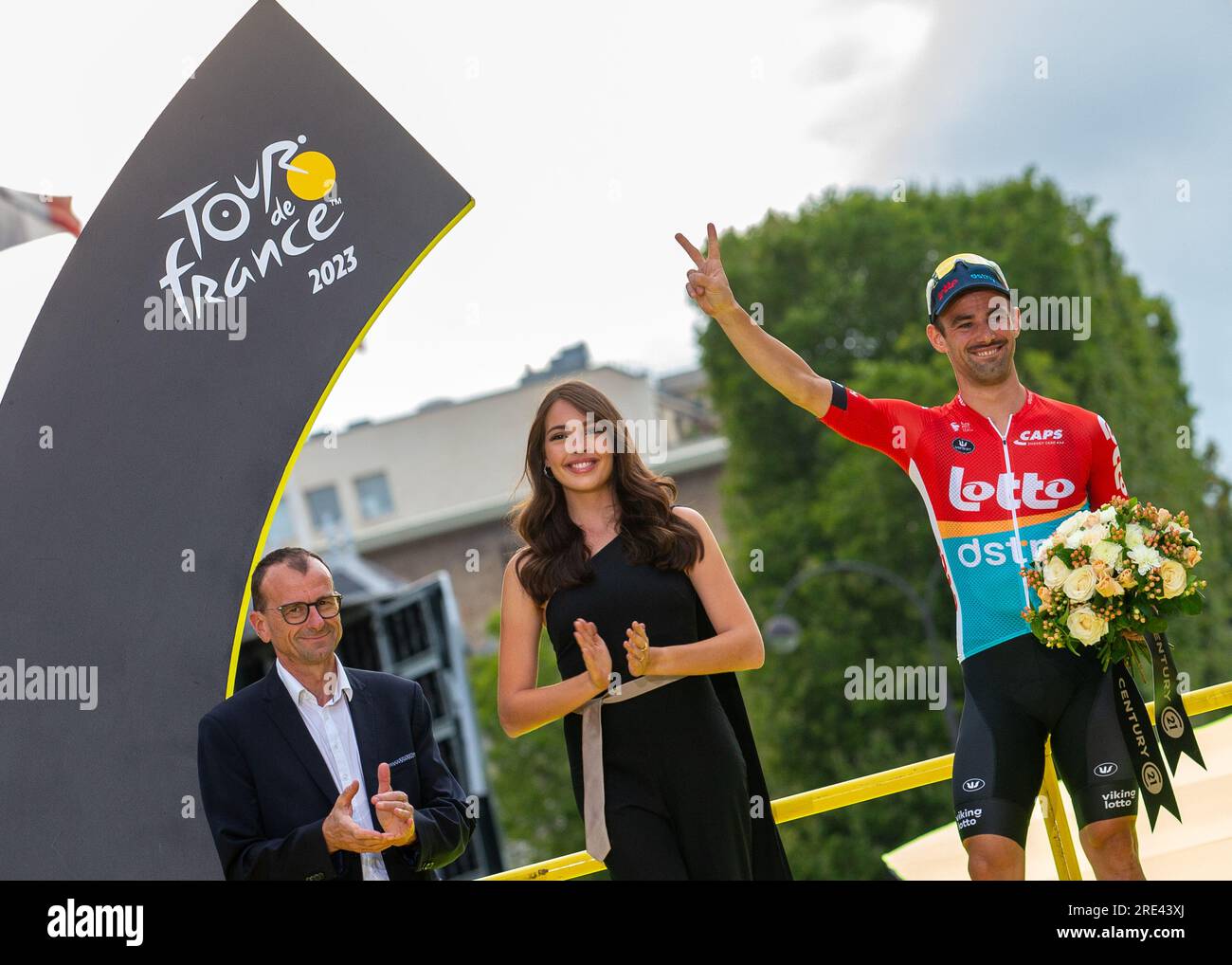 LOTTO DSTNY rider VICTOR CAMPENAERTS on the podium taking the well deserved overall most combative rider award after stage 21, Saint Quentin-en-Yvelin Stock Photo