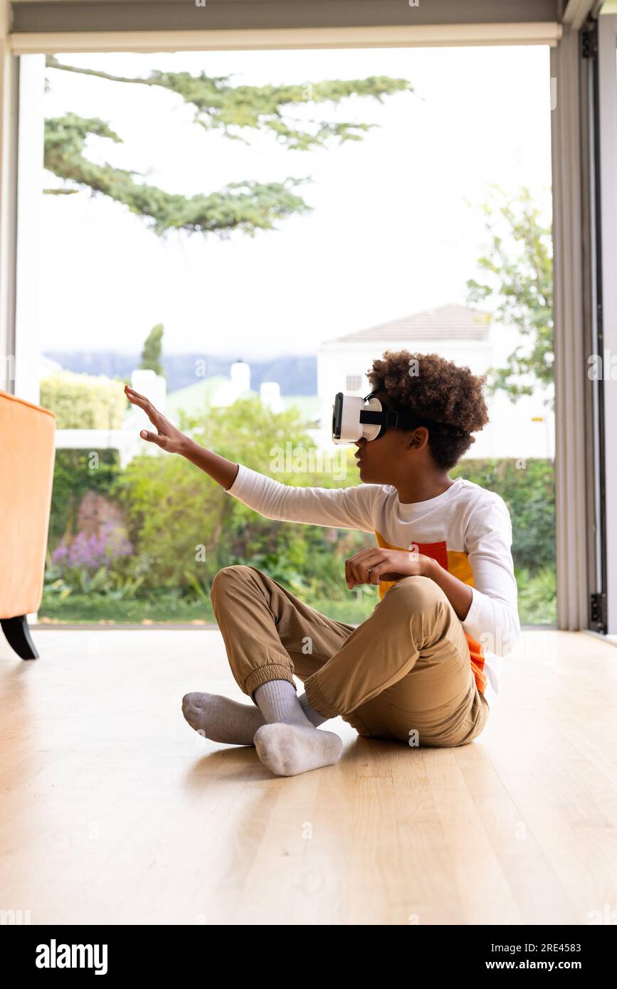 African boy sitting on floor hi-res stock photography and images - Alamy