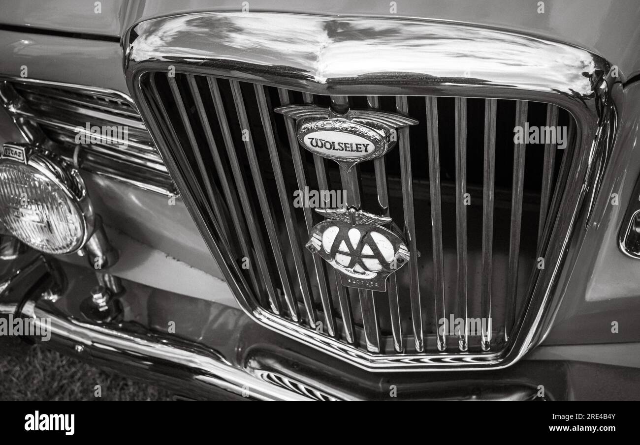 The chrome front radiator grill of a renovated grey 1966 Wolseley 16/60