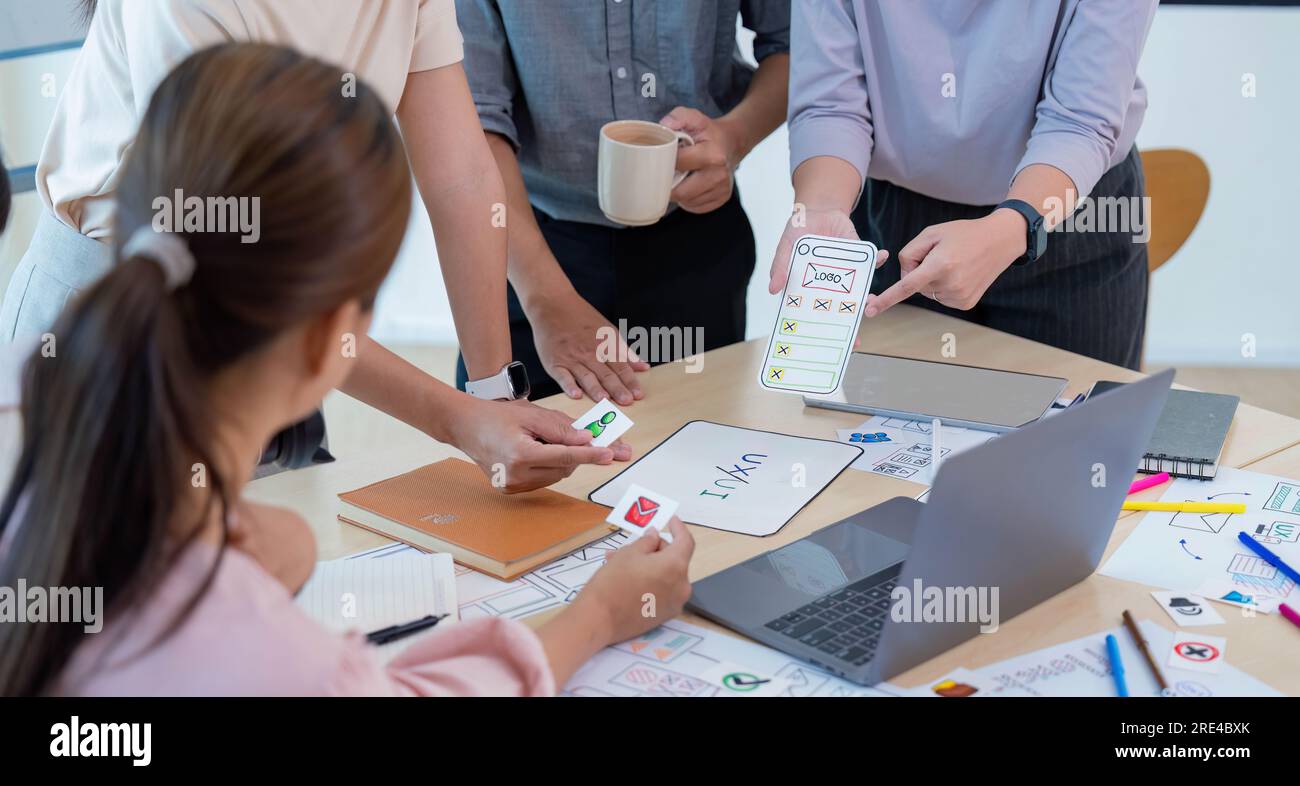 Close up ux developer and ui designer brainstorming interface wireframe design.Creative digital development agency Stock Photo