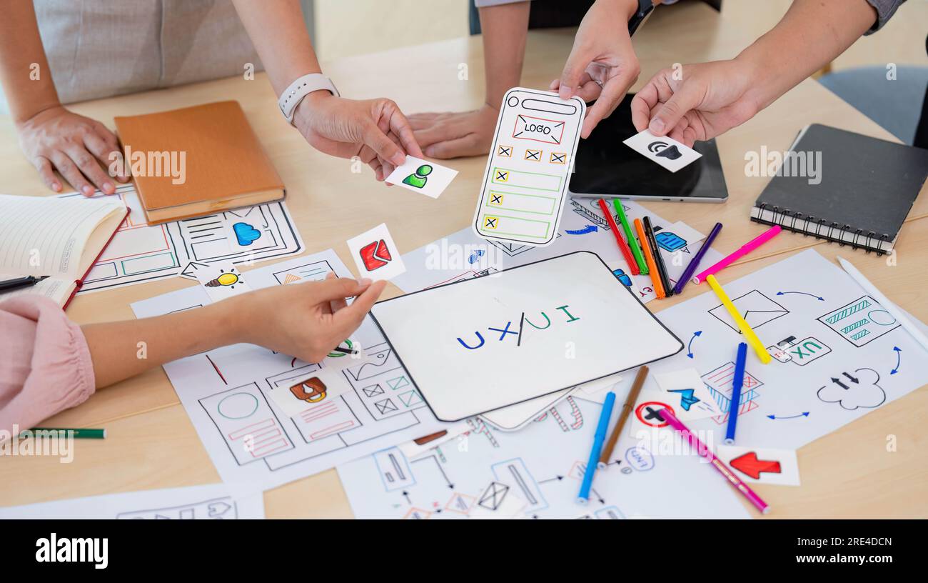 Close up ux developer and ui designer brainstorming interface wireframe ...