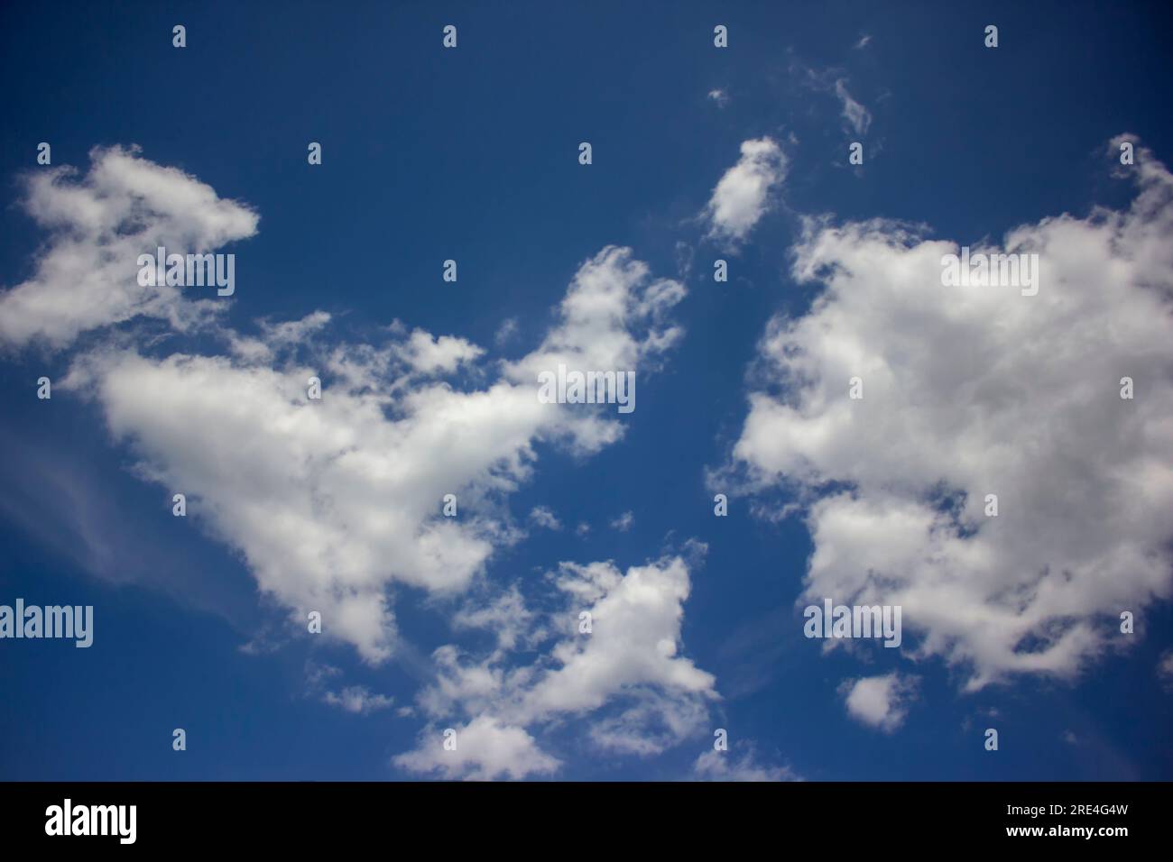 White clouds in the blue sky. Stock Photo