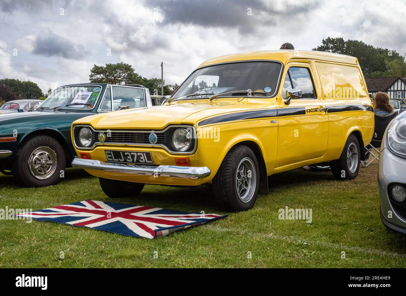 A rare 1973 bright yellow vintage Ford Escort Mk1 van on display at a classic car show in Storrington, West Sussex, UK. Stock Photo