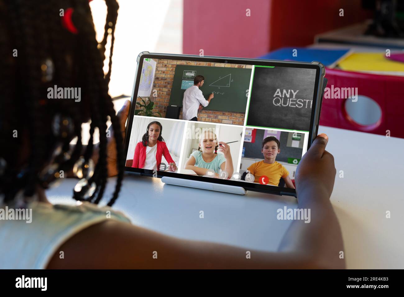African american girl having a video conference on tablet with male ...
