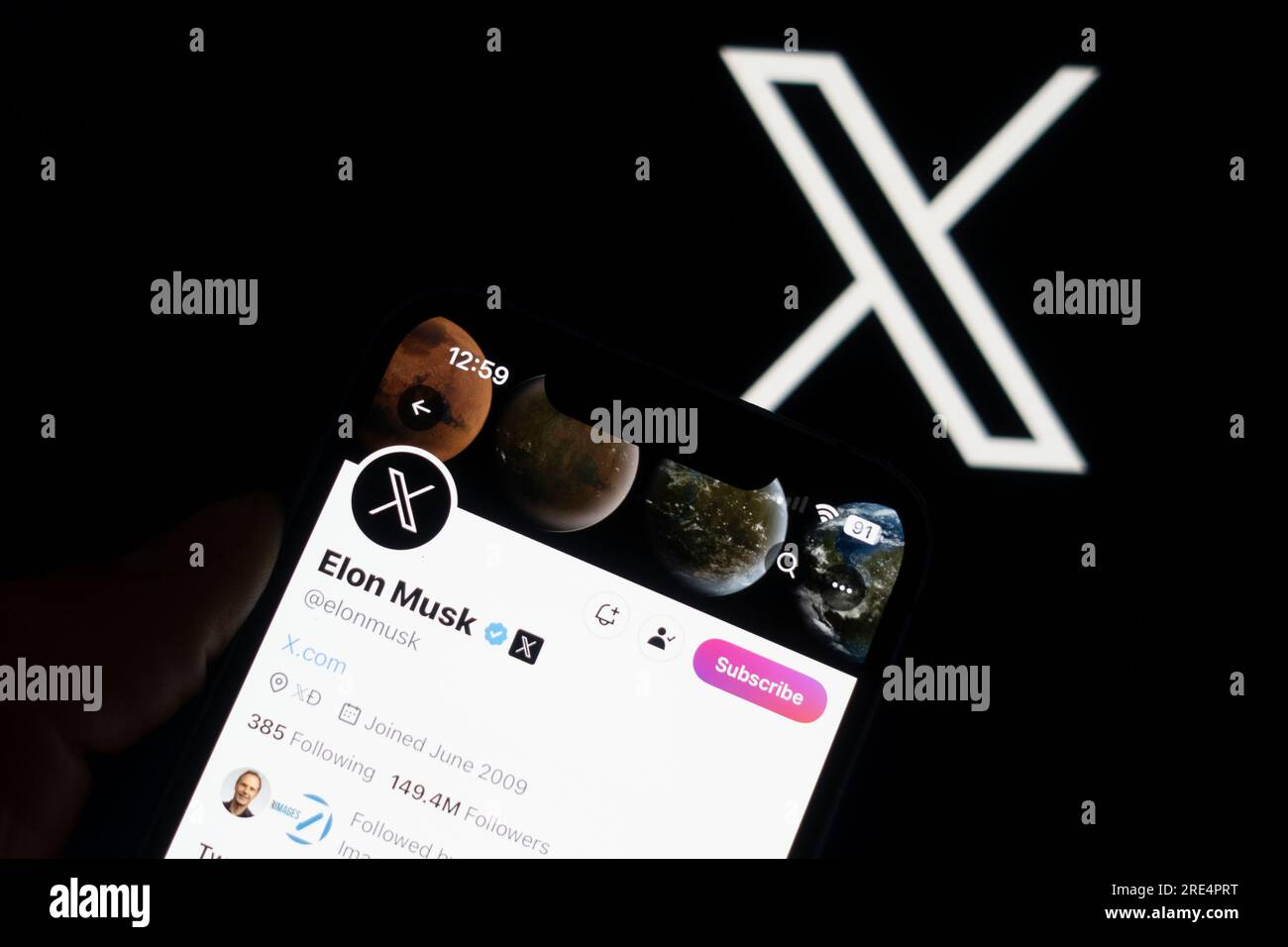 Edinburgh, Scotland, UK. 25 July 2023. A photo illustration showing Elon Musk’s X page against the logo of the new Twitter which has been rebranded X by owner Elon Musk. Iain Masterton/Alamy Live News Stock Photo