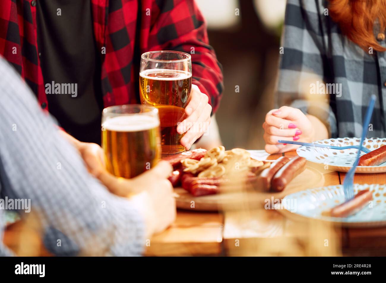 Beer Meating People, friends meeting at pub, restaurant to drink beer. Glasses with ...