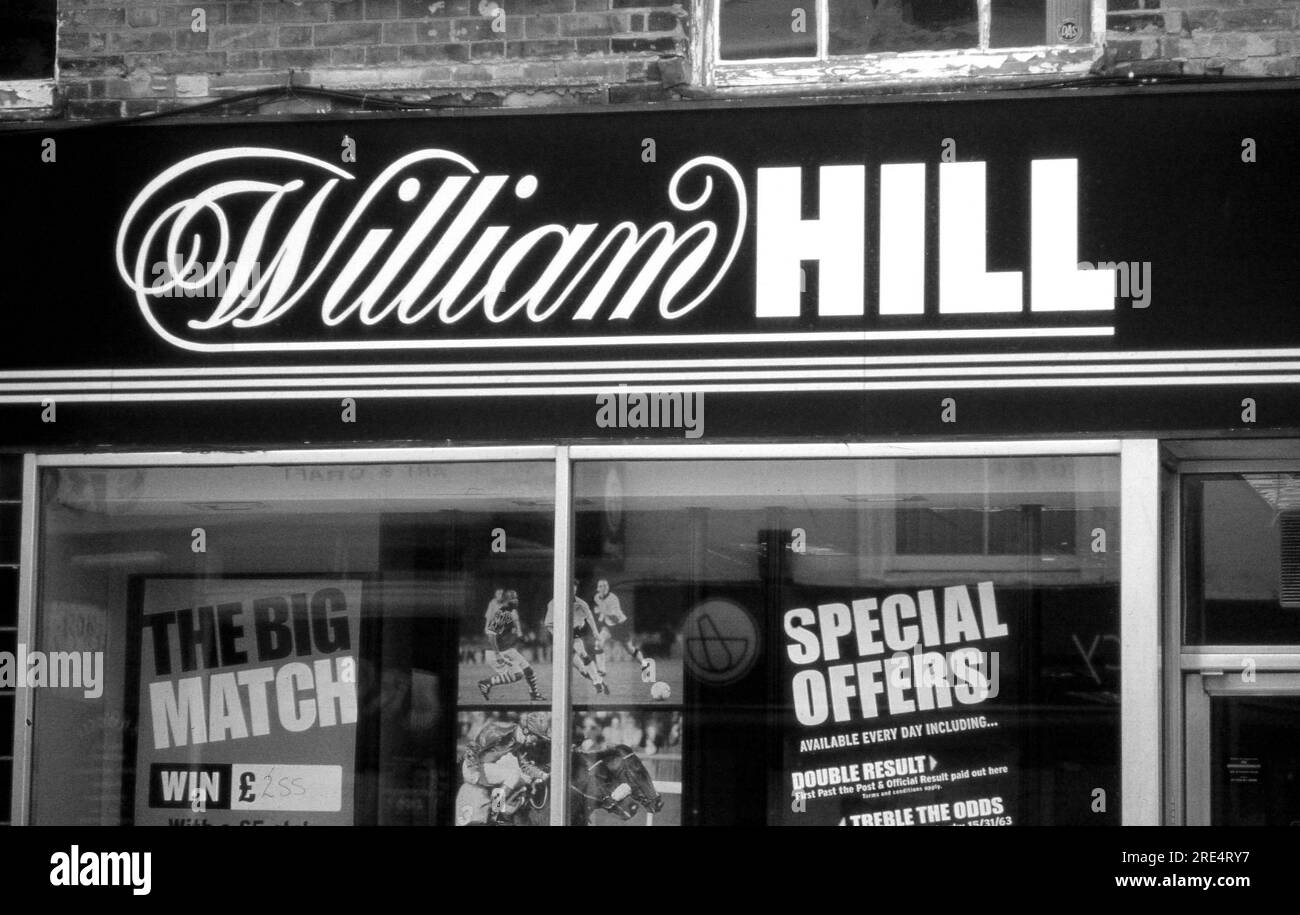 Signage outside a branch of the William Hill bookmaking chain at Ashford in Kent, England on May 1, 2005. Founded in 1934, the business now has 1414 stores. Stock Photo