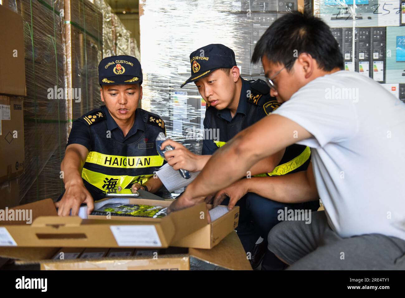 (230725) -- ALATAW PASS, July 25, 2023 (Xinhua) -- Custom staff check on cargo at the custom clearance center for the cross-border e-commerce of the Alataw Pass comprehensive bonded area in northwest China's Xinjiang Uygur Autonomous Region, July 24, 2023. In recent years, various measures have been taken to create a better business environment for cross-border e-commerce enterprises in Alataw Pass. The cross-border e-commerce business was launched in the inland port in northwest China's Xinjiang Uygur Autonomous Region in January 2020. In the first half of this year, more than 14.50 million c Stock Photo