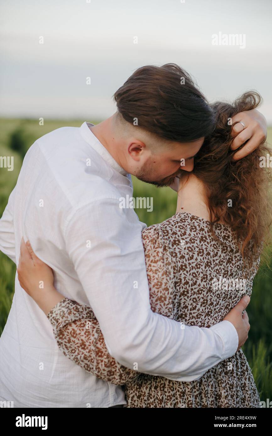 Couple in love. Man kissing a woman Stock Photo - Alamy