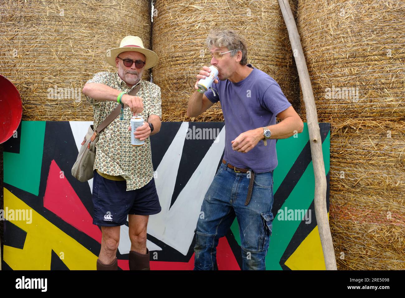Two men at a festival drinking beer. Stock Photo