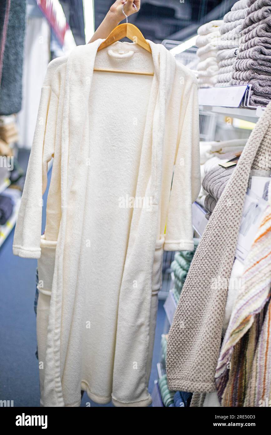 keep a white bathrobe on a hanger in the store to try on. Purchases ...