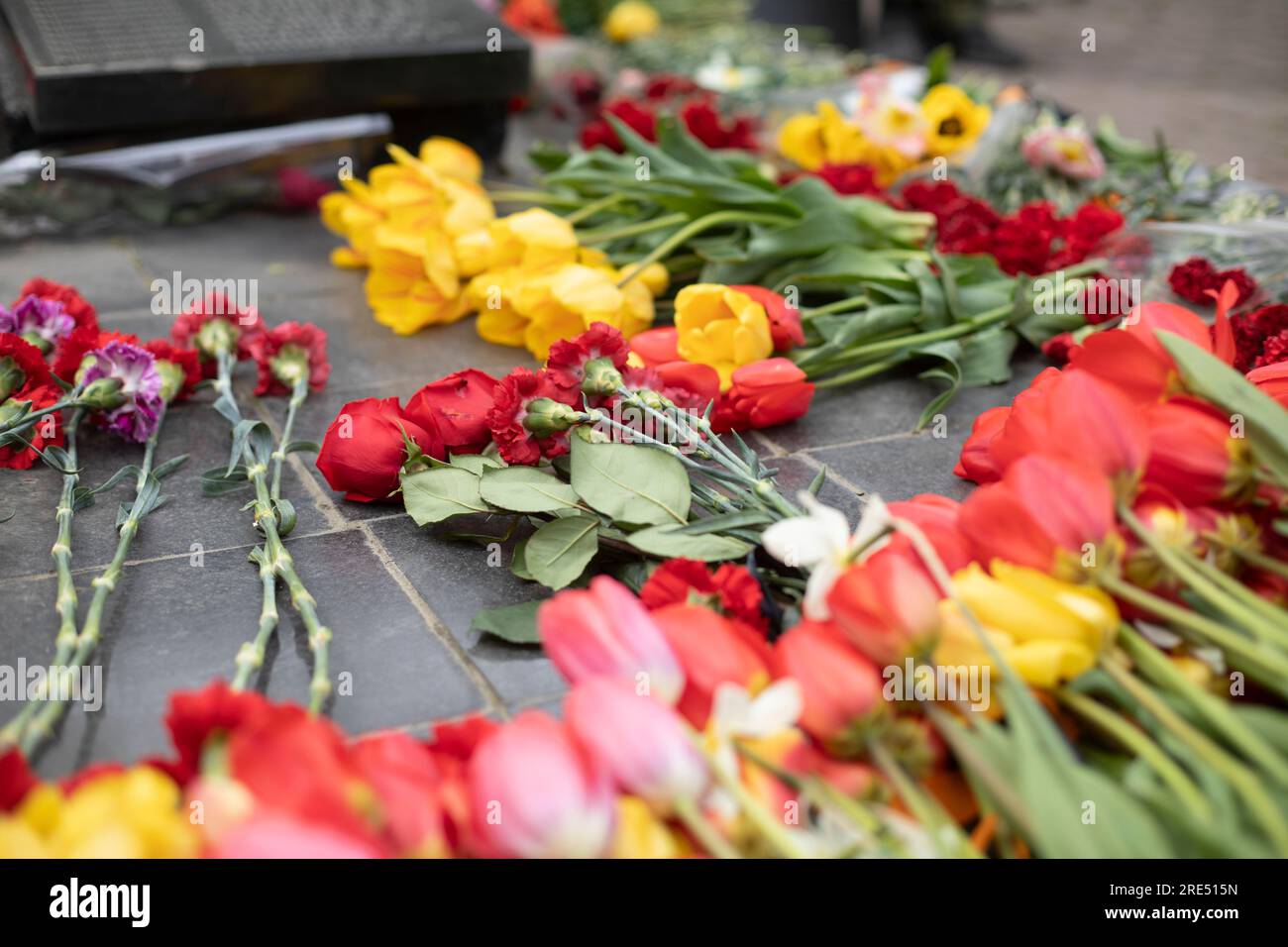 Flowers on war monument. Flowers on grave of soldier. Remembrance