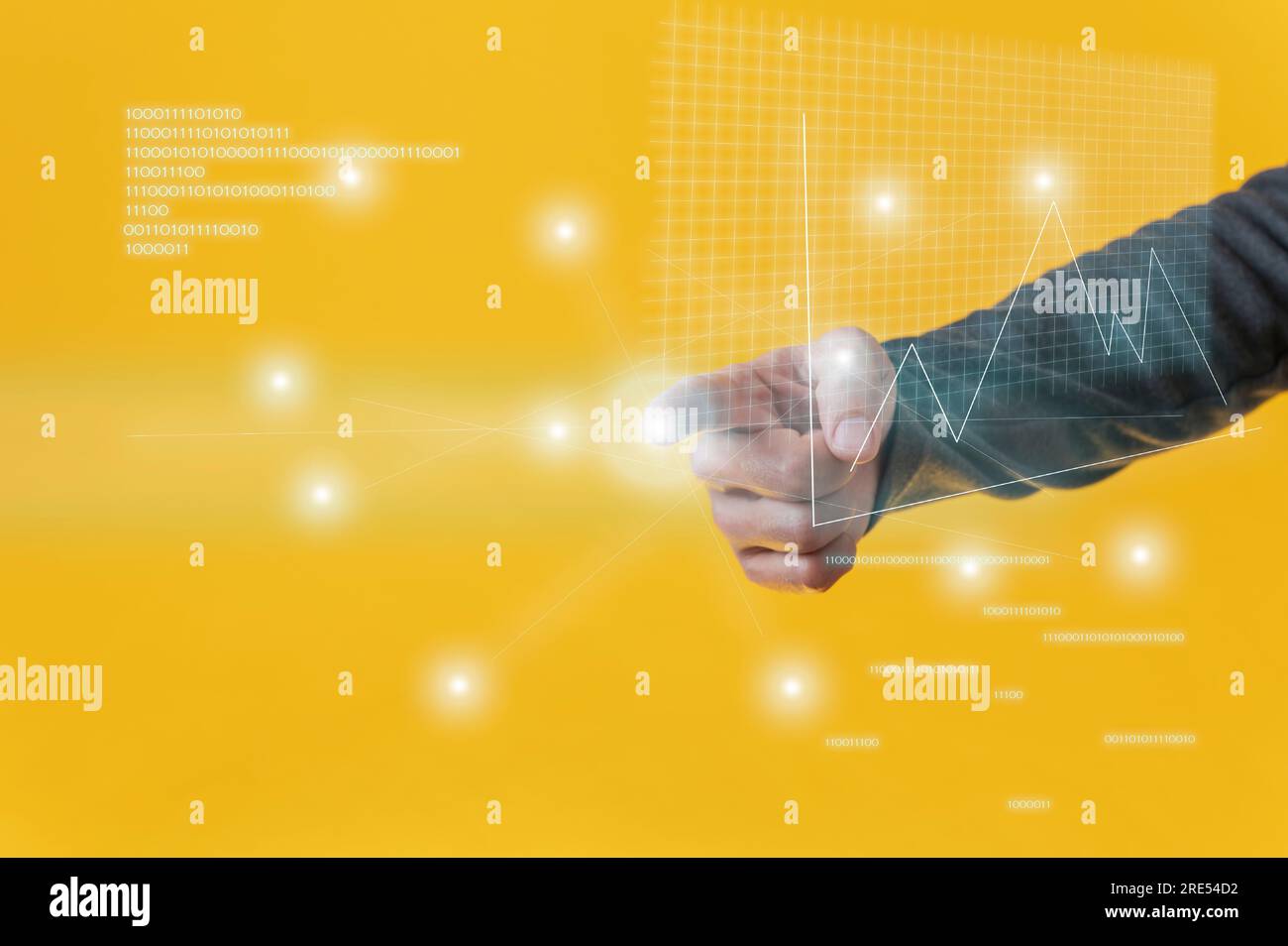 Male hand performing a presentation on virtual interface with financial graphs and binary code digits glowing over yellow background. Stock Photo