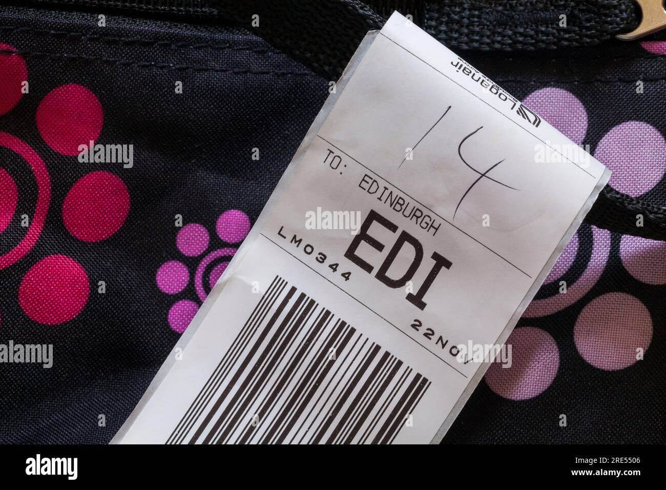 Loganair luggage label stuck on case for EDI Edinburgh airport in