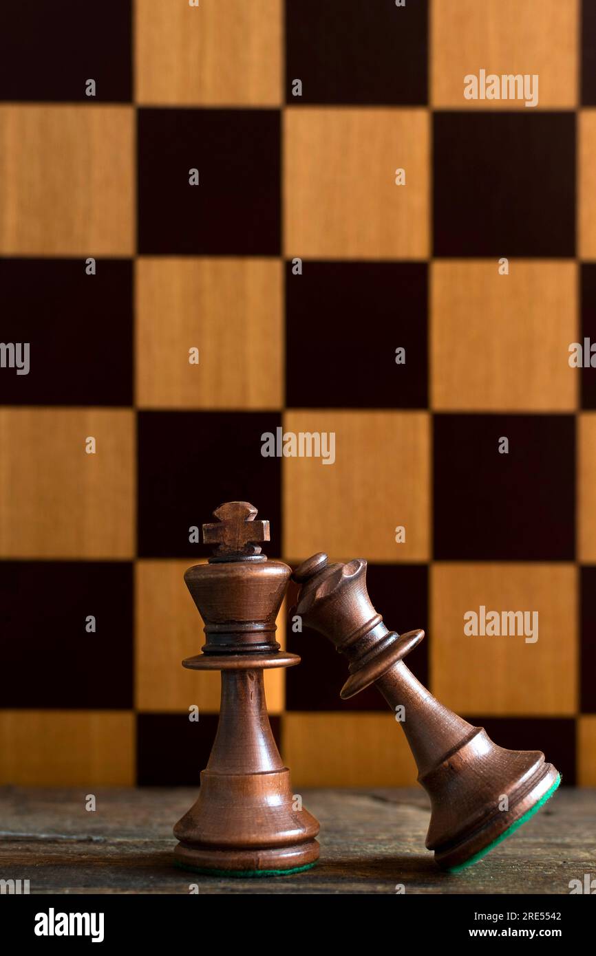 Queen and king, chess pieces and chessboard Stock Photo