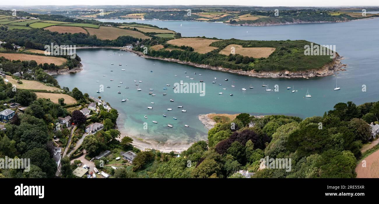 An aerial landscape view of the small Cornish villages of Gillan and St Anthony-In-Meneage which are on the South West Coast Path in Cornwall Stock Photo